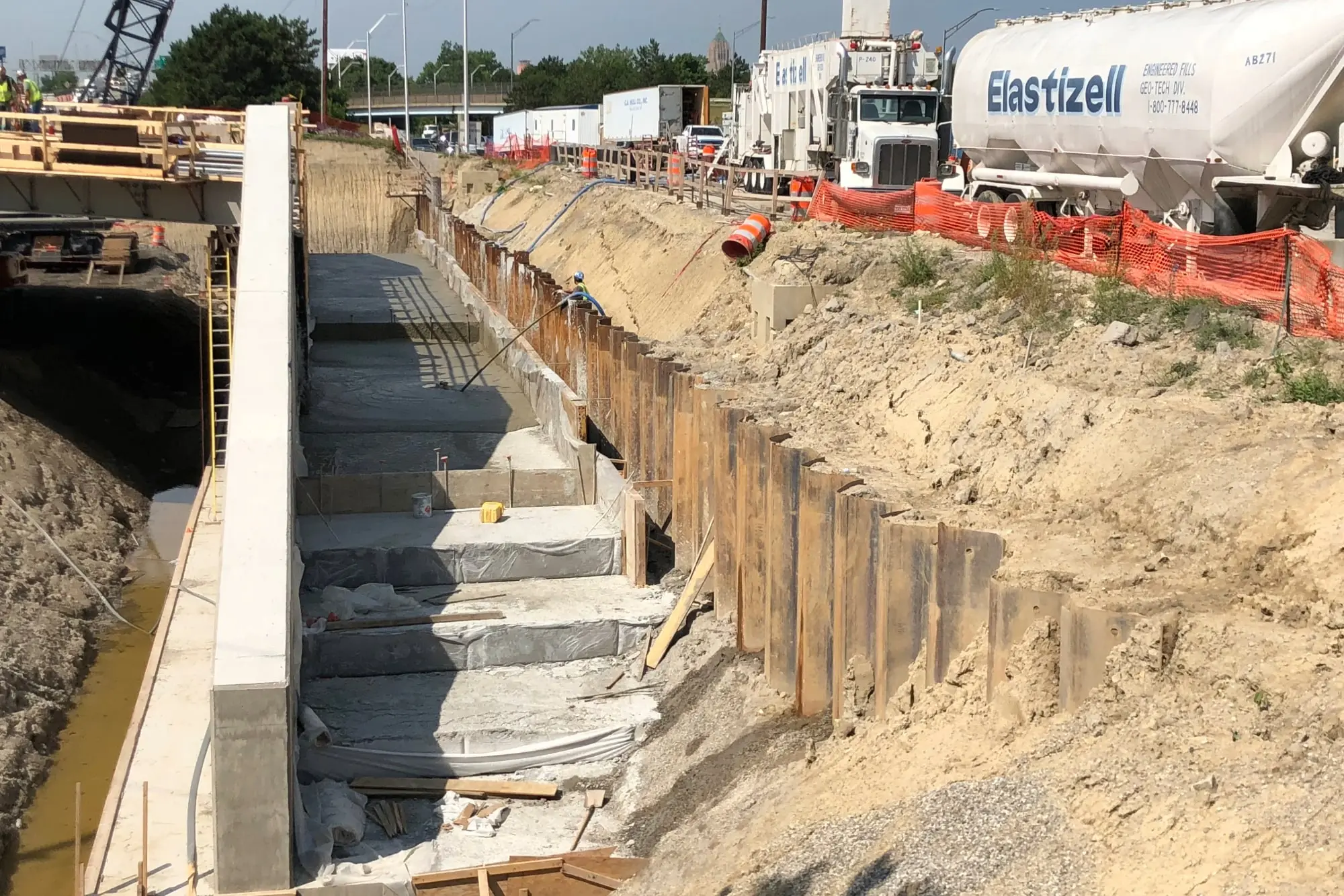 Elastizell Systems using lightweight cellular concrete to backfill and stabilize a retaining wall in Detroit, Michigan