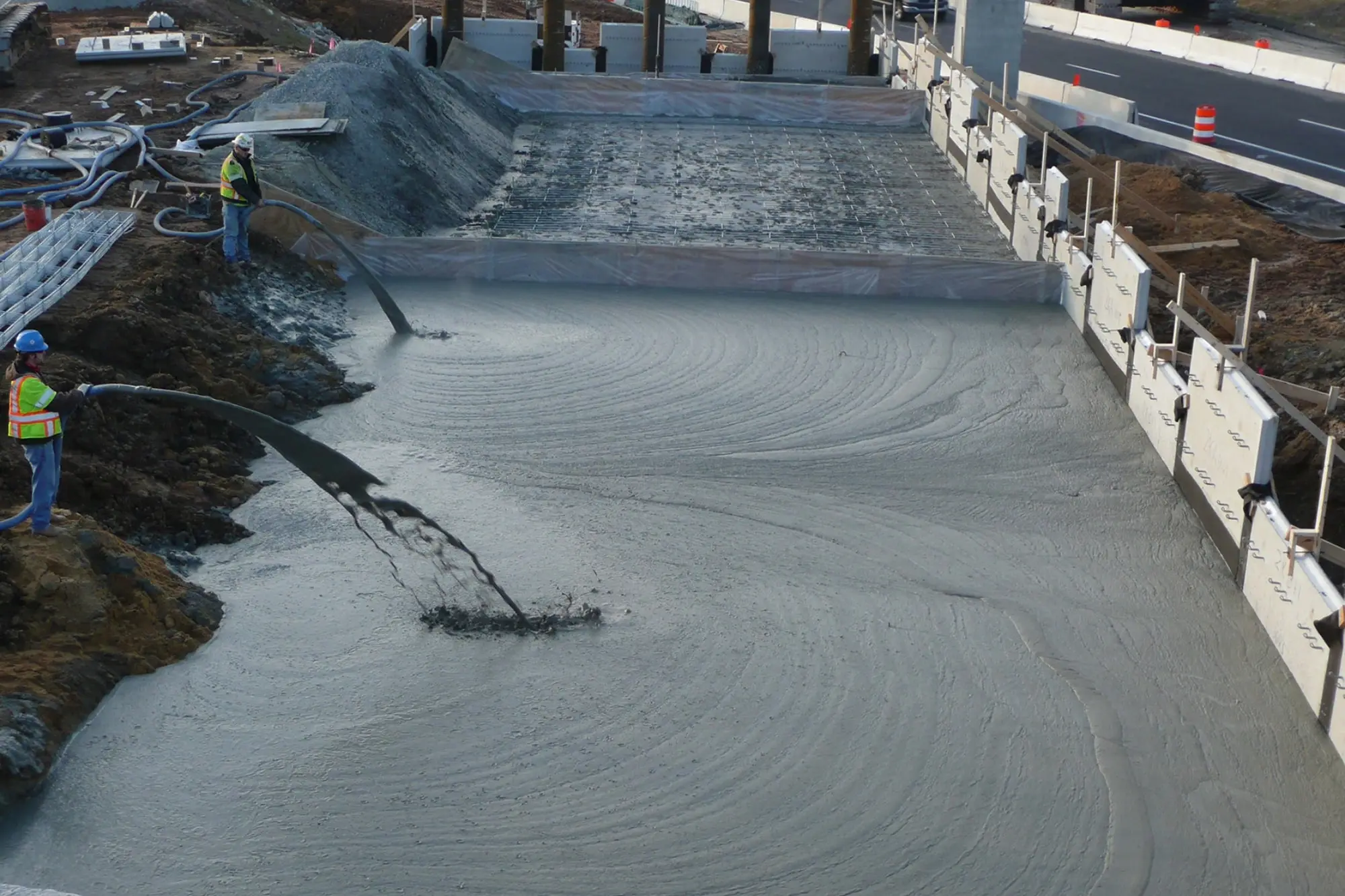 Elastizell Systems applying lightweight cellular concrete to install a roadway sub-base in Nashville, Tennessee, for improved stability and support